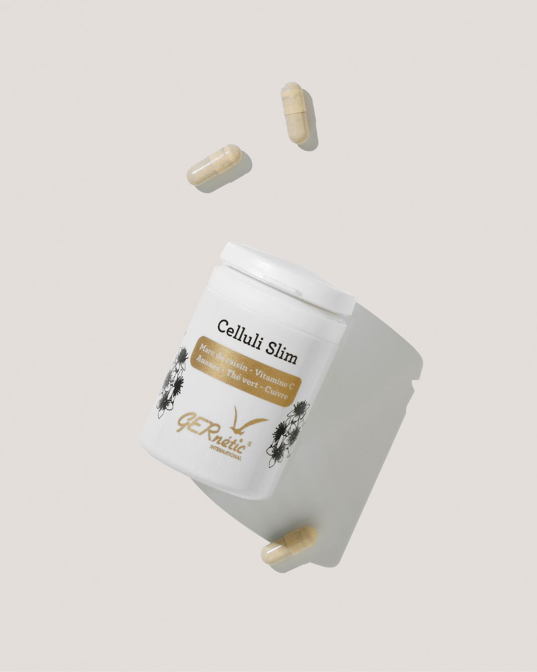 Kaksi GERnétic International Celluli Slim -ravintolisän kapselia, luonnollinen apu rasvan vähentämiseen ja ihon kimmoisuuden parantamiseen.